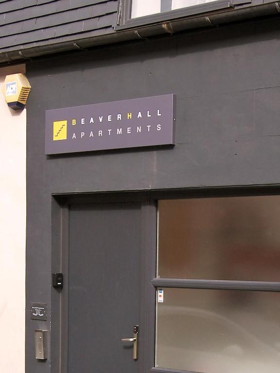 a sign on the side of a building at Beaverhall Holiday Apartments in Edinburgh