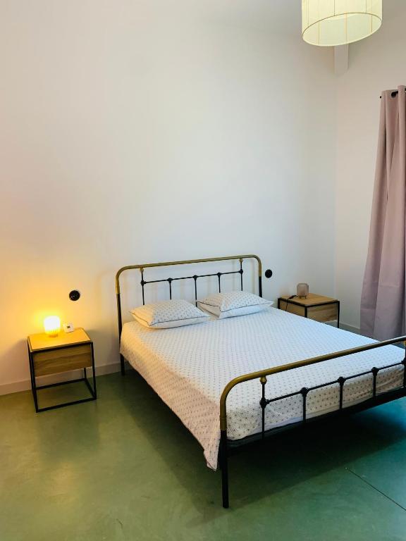 Postel nebo postele na pokoji v ubytování Appart'hotel Fior Di Ribba
