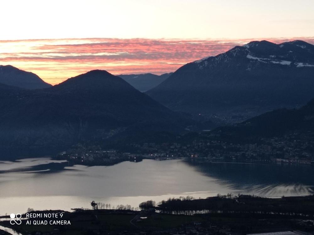 a view of a body of water with mountains at CASA DELLE API in Pisogne