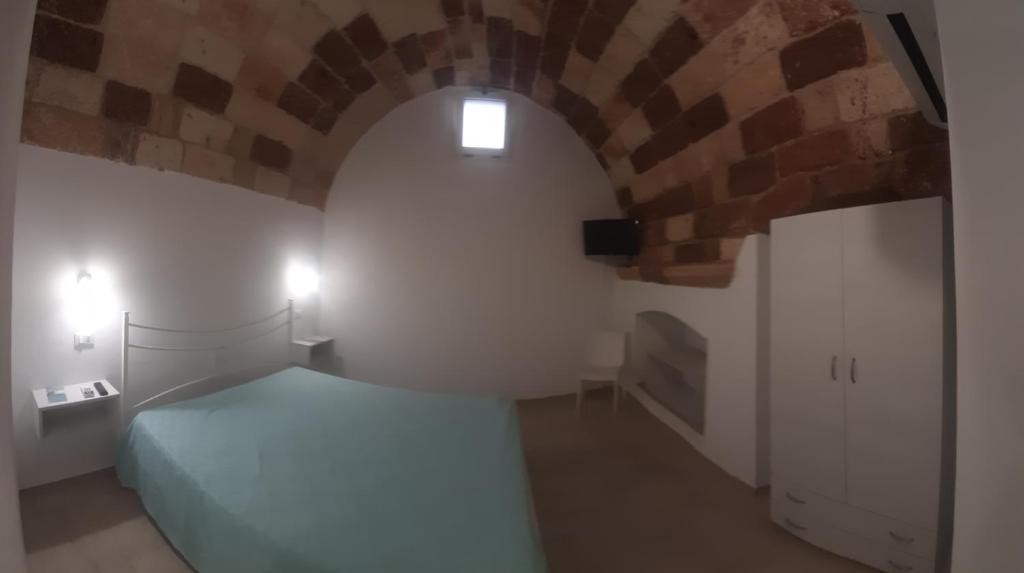 Postel nebo postele na pokoji v ubytování TORRE SUL MARE affittacamere Ugento