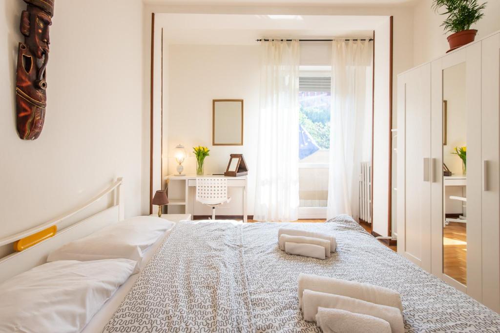Postel nebo postele na pokoji v ubytování Milano Guest House