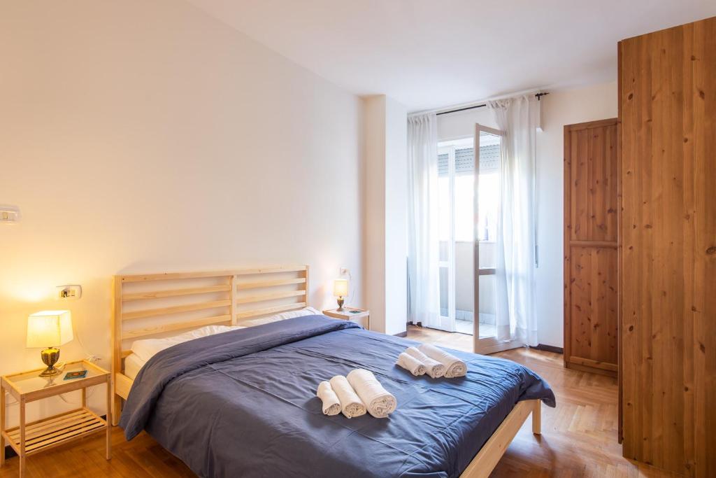 Postel nebo postele na pokoji v ubytování Milano Guest House