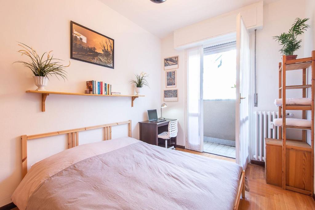 Postel nebo postele na pokoji v ubytování Milano Guest House