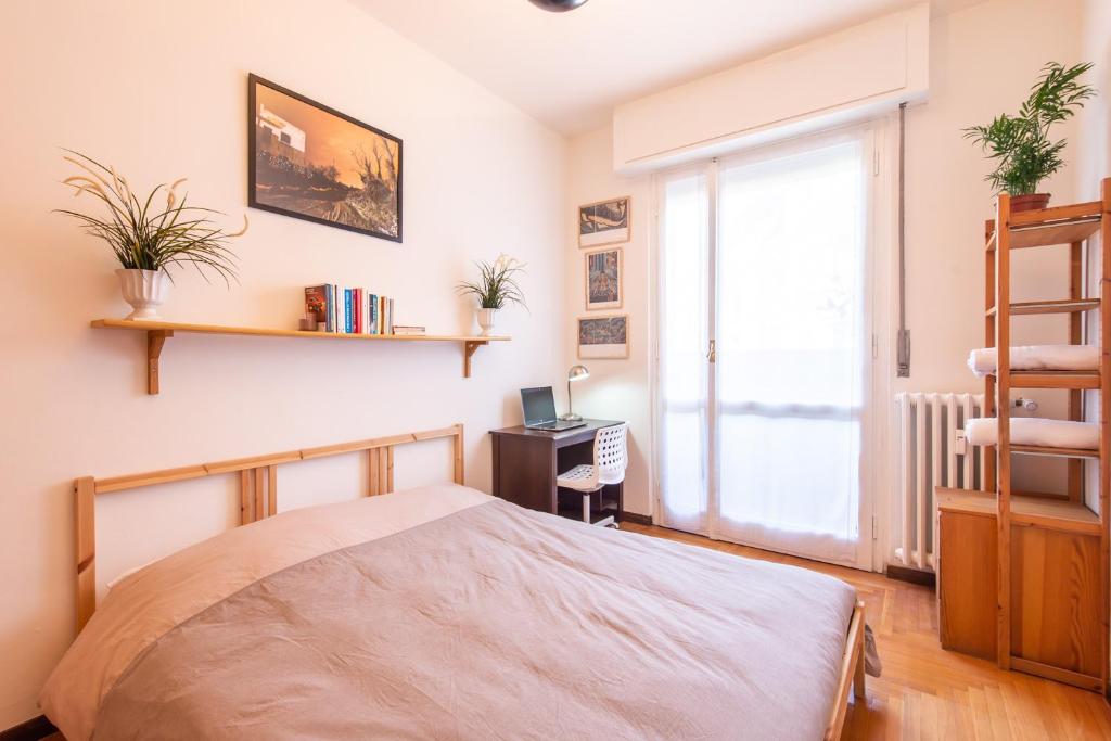 Postel nebo postele na pokoji v ubytování Milano Guest House