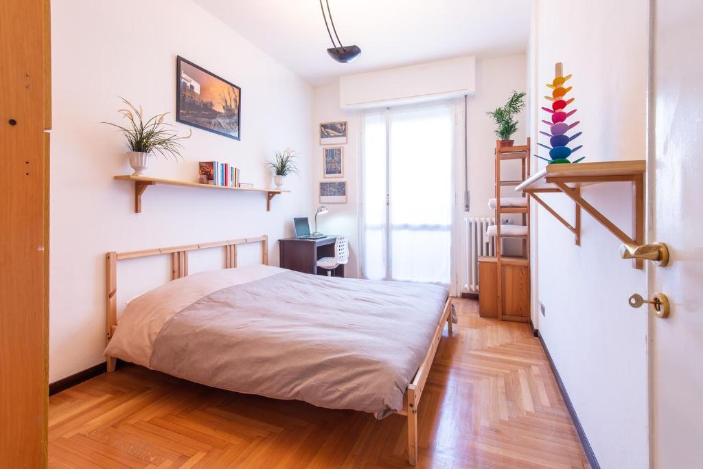 Postel nebo postele na pokoji v ubytování Milano Guest House