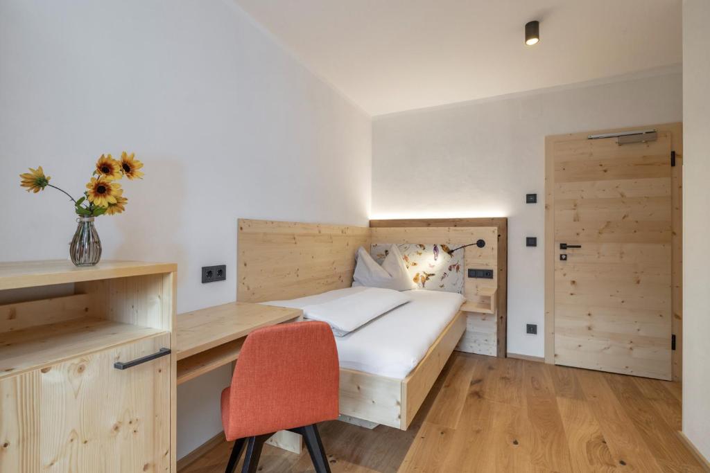 Postel nebo postele na pokoji v ubytování Hotel Winkler-Tuschnig