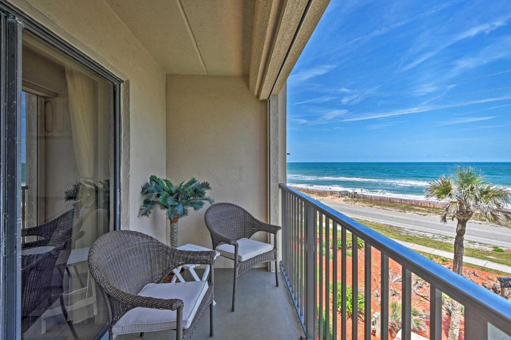 a balcony with chairs and a view of the ocean at Oceanfront Ormond Beach Getaway with Balcony! in Ormond Beach