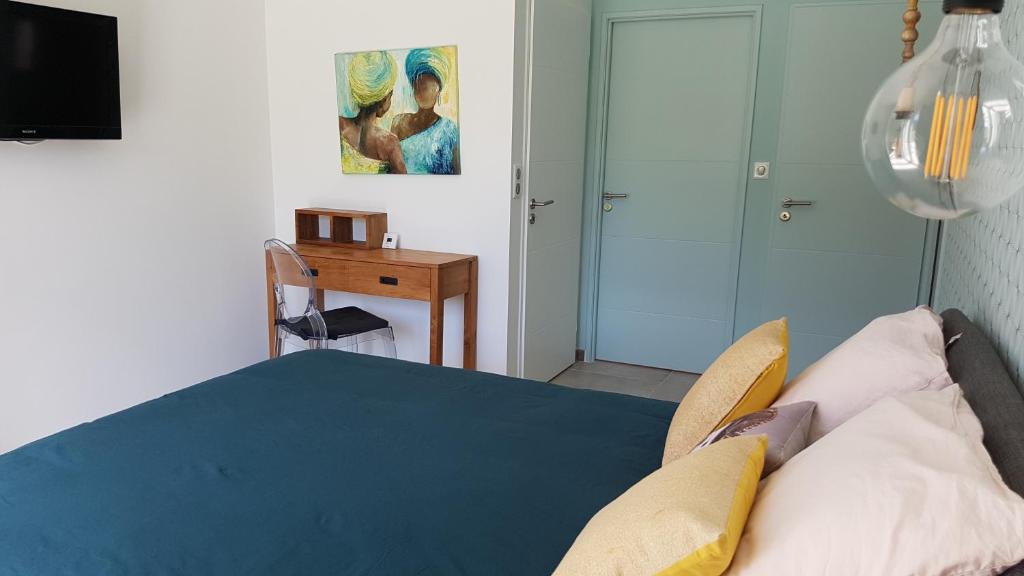 Postel nebo postele na pokoji v ubytování L’Abrico’thym