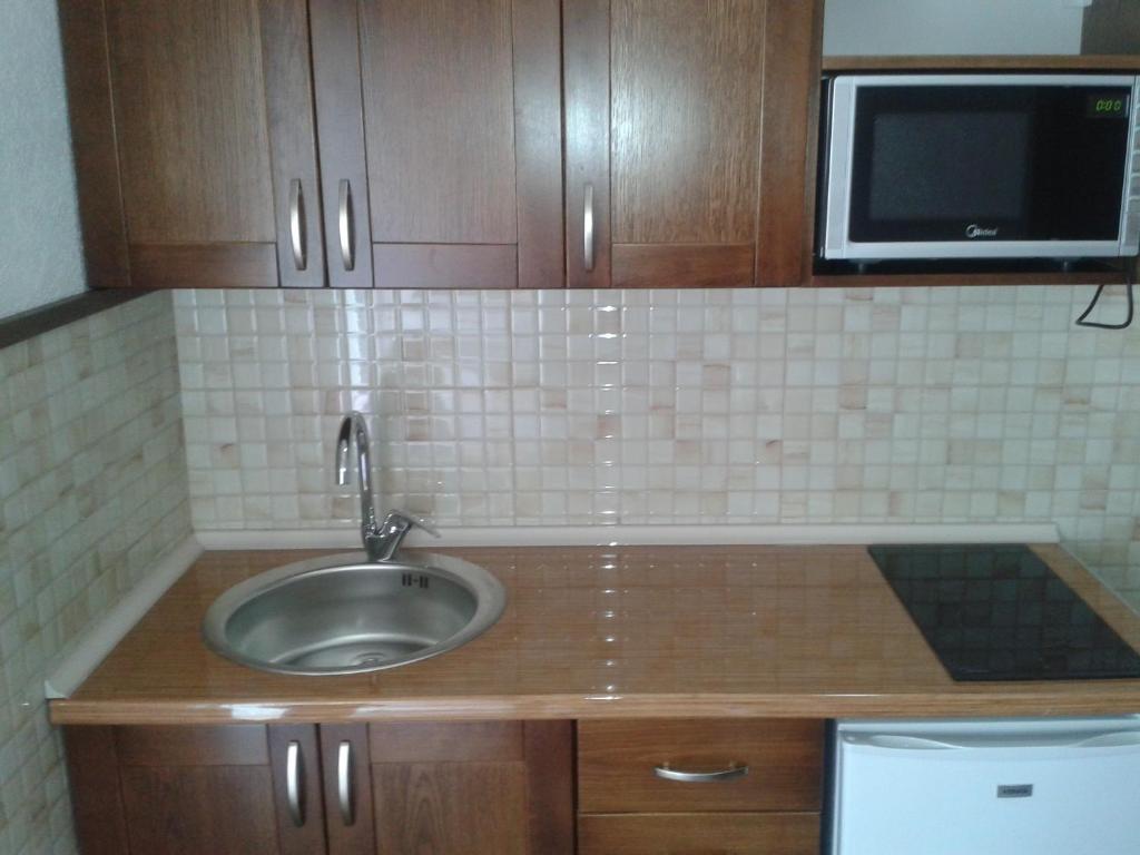 Kuchyň nebo kuchyňský kout v ubytování Arabela Apartments