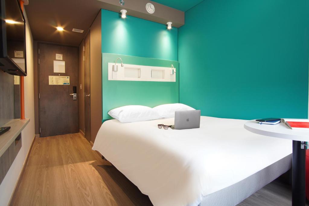 Postel nebo postele na pokoji v ubytování ibis budget Bogota Marly