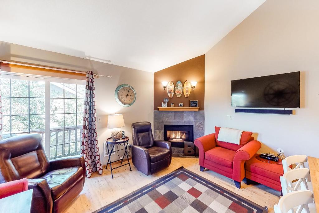 a living room filled with furniture and a fireplace at South Hemlock in Cannon Beach
