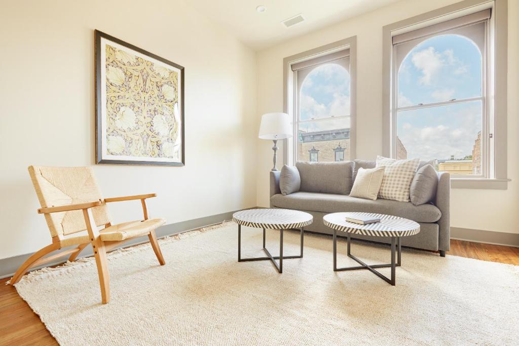 a living room with a couch and a chair at Sonder Telfair Square in Savannah