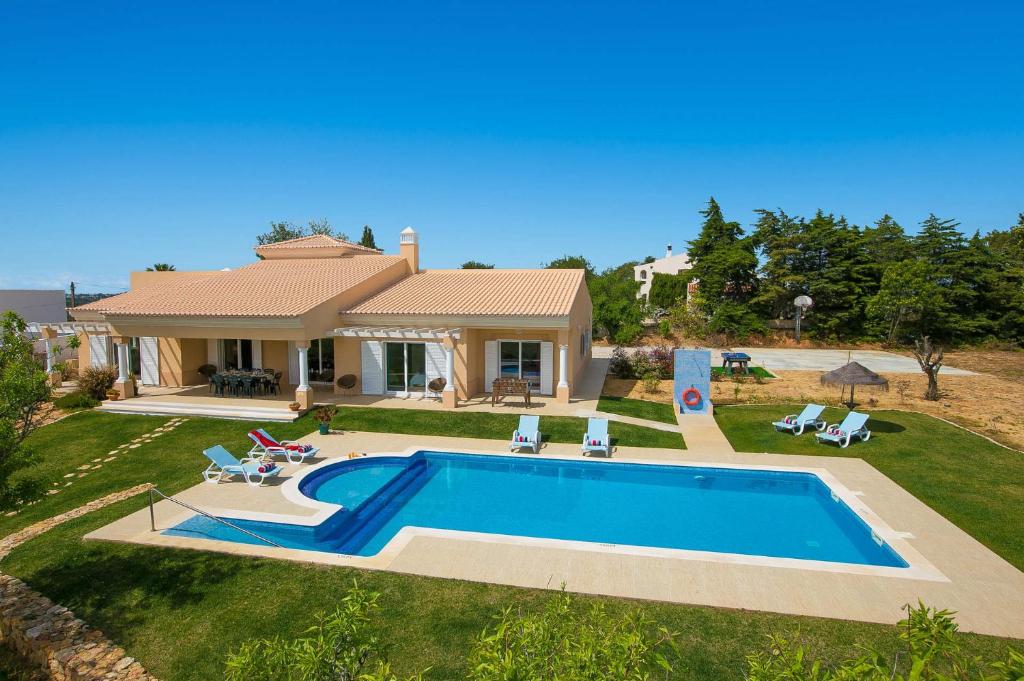 an aerial view of a house with a swimming pool at Villa Viana by Villa Plus in Lagoa