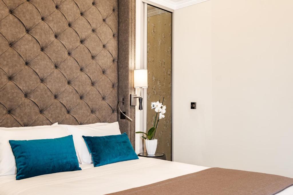 Postel nebo postele na pokoji v ubytování Hotel Pjazza Merkanti - Boutique Living