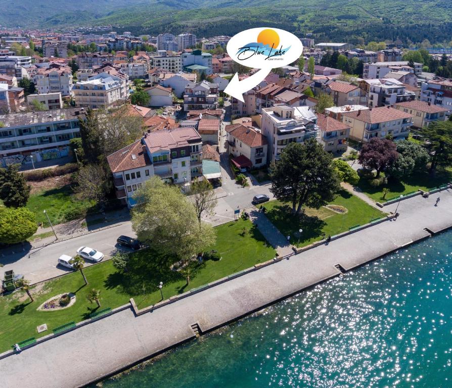 an aerial view of a city next to a body of water at Blue Lake Apartments in Ohrid
