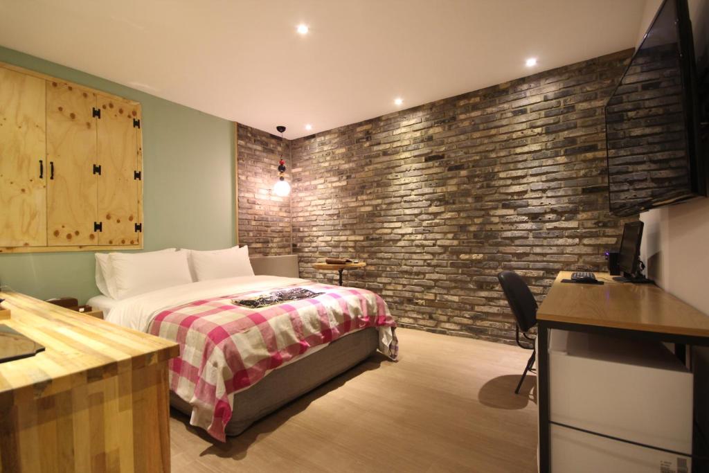 Postel nebo postele na pokoji v ubytování Hotel 25 Seomyeon