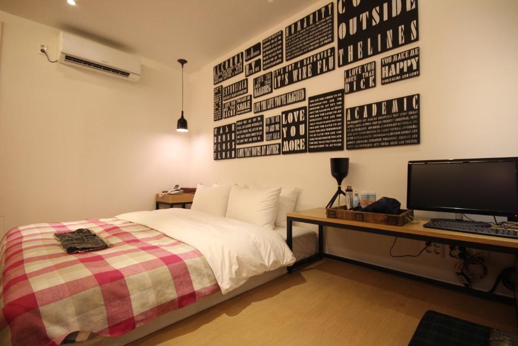 Postel nebo postele na pokoji v ubytování Hotel 25 Seomyeon