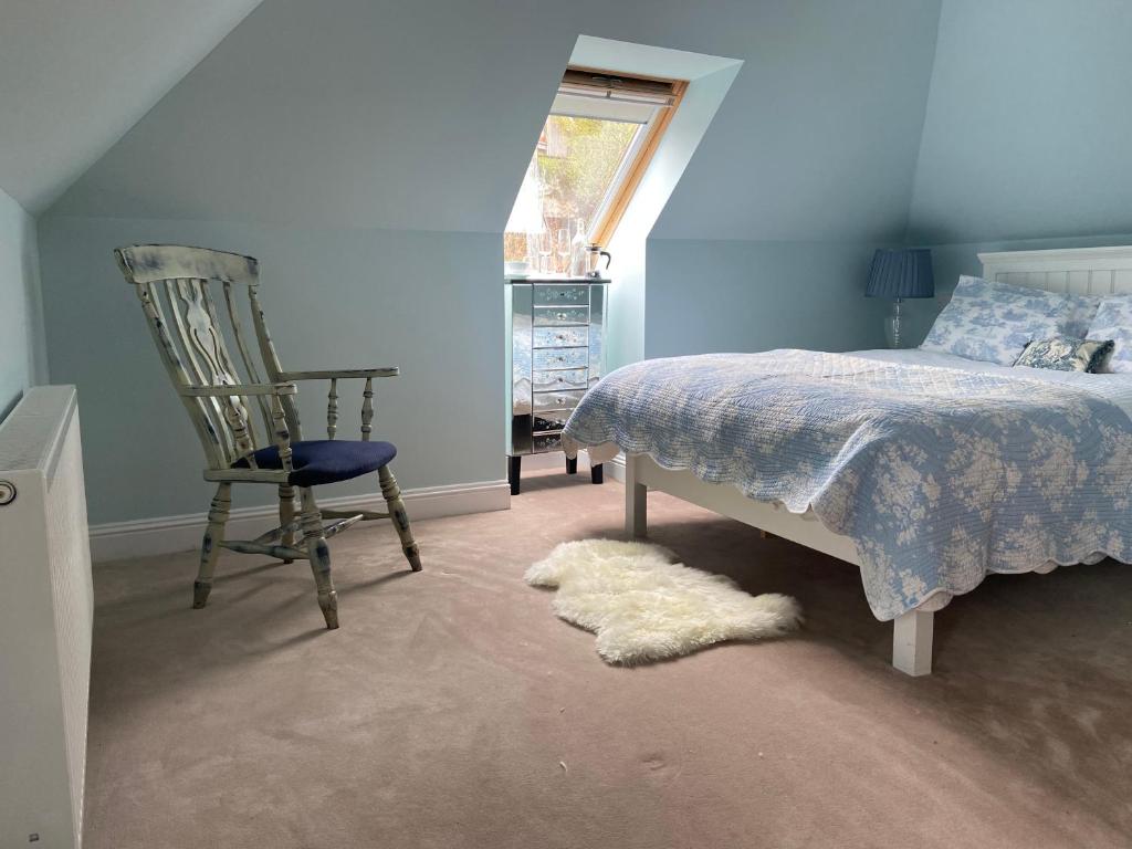 Craggan Lodge tesisinde bir odada yatak veya yataklar