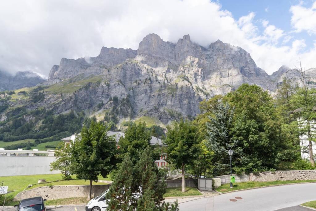 a mountain with a car parked in front of it at Cristal 28 in Leukerbad