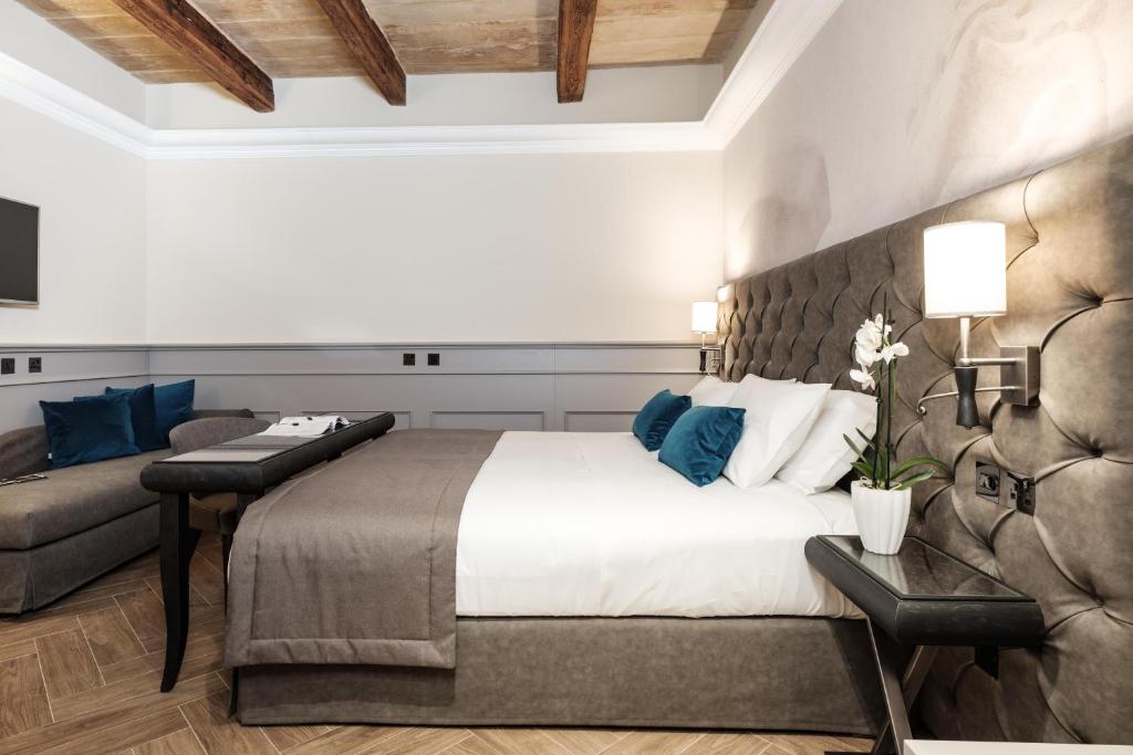 Postel nebo postele na pokoji v ubytování Hotel Pjazza Merkanti - Boutique Living