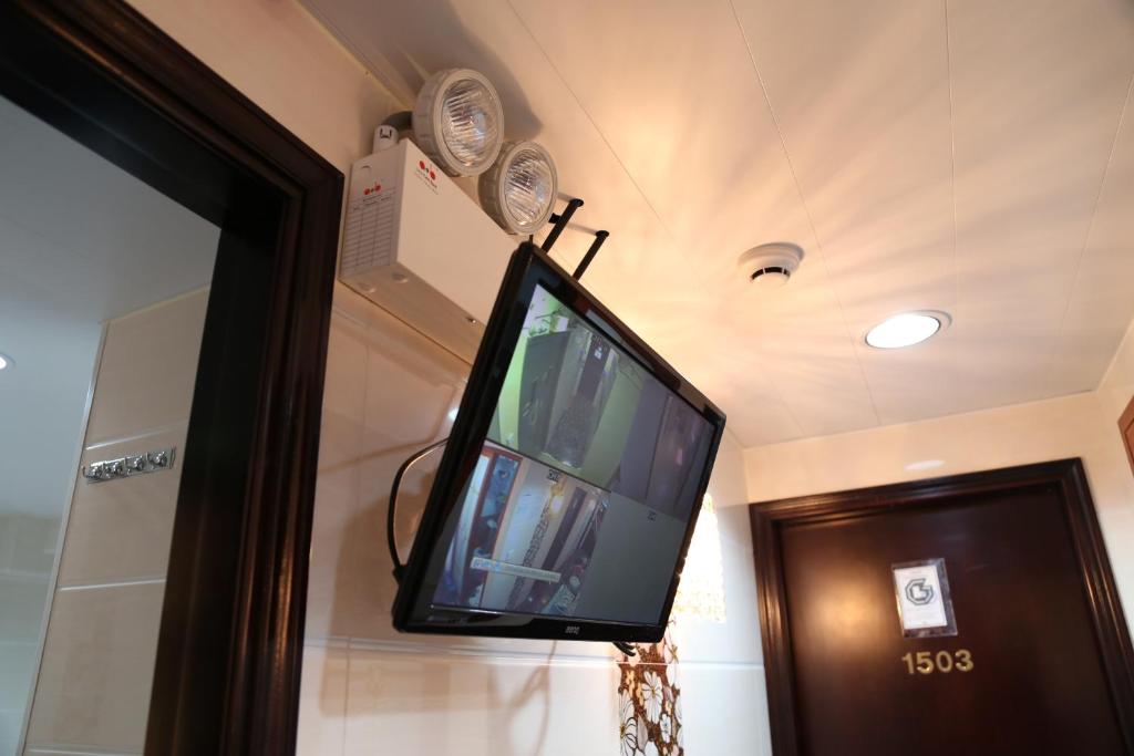 En tv och/eller ett underhållningssystem på Holland Guest House