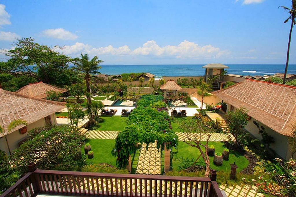 an aerial view of a resort with the ocean at Villa Teresa in Canggu