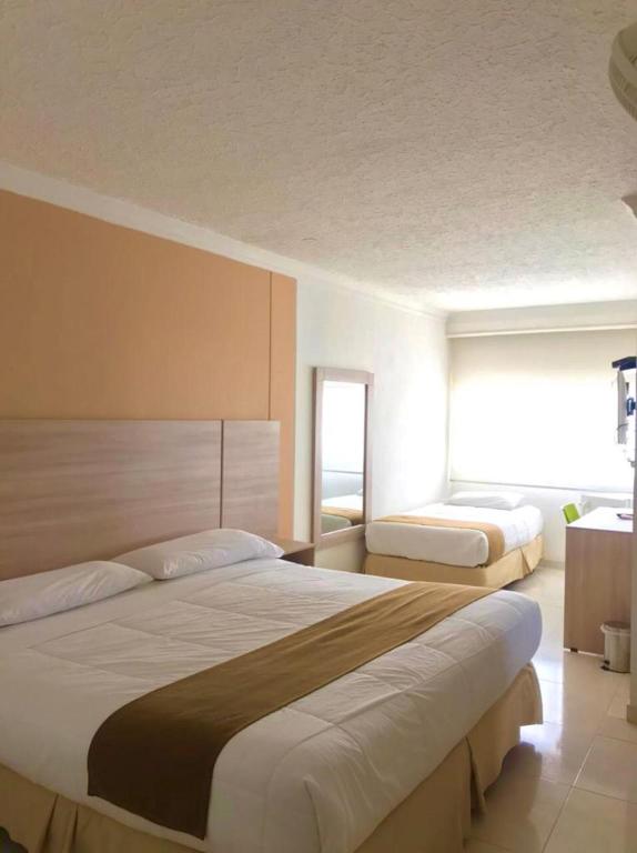 Postel nebo postele na pokoji v ubytování Vajamar Hotel