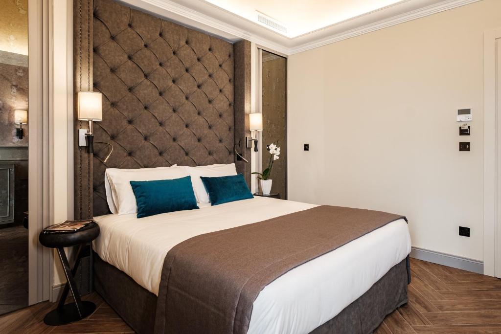 Postel nebo postele na pokoji v ubytování Hotel Pjazza Merkanti - Boutique Living