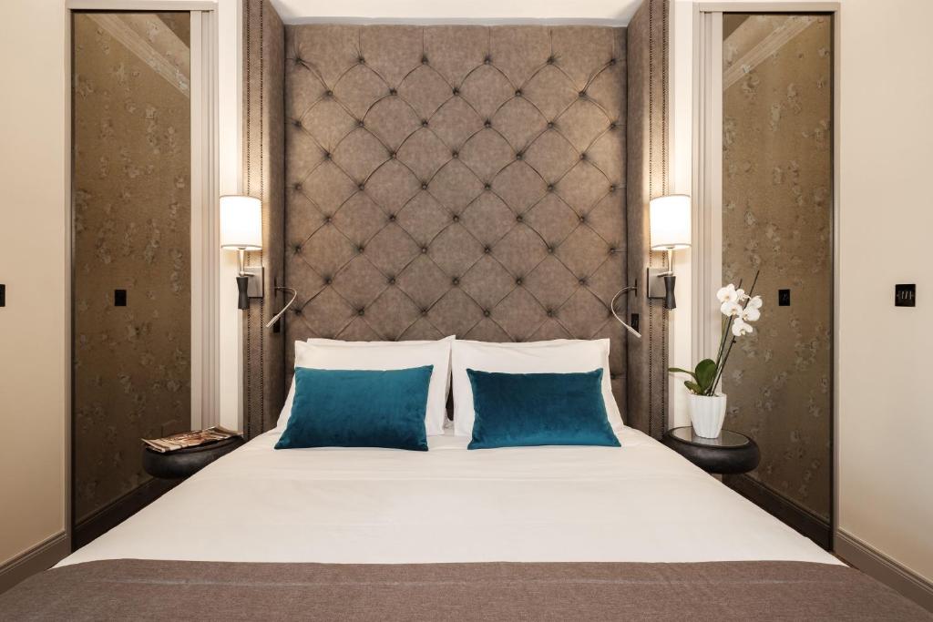 Postel nebo postele na pokoji v ubytování Hotel Pjazza Merkanti - Boutique Living