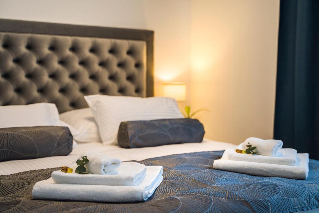 Posteľ alebo postele v izbe v ubytovaní RC Apartment