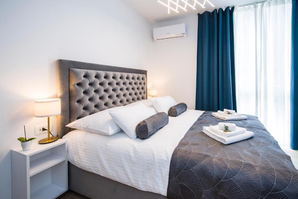 Posteľ alebo postele v izbe v ubytovaní RC Apartment