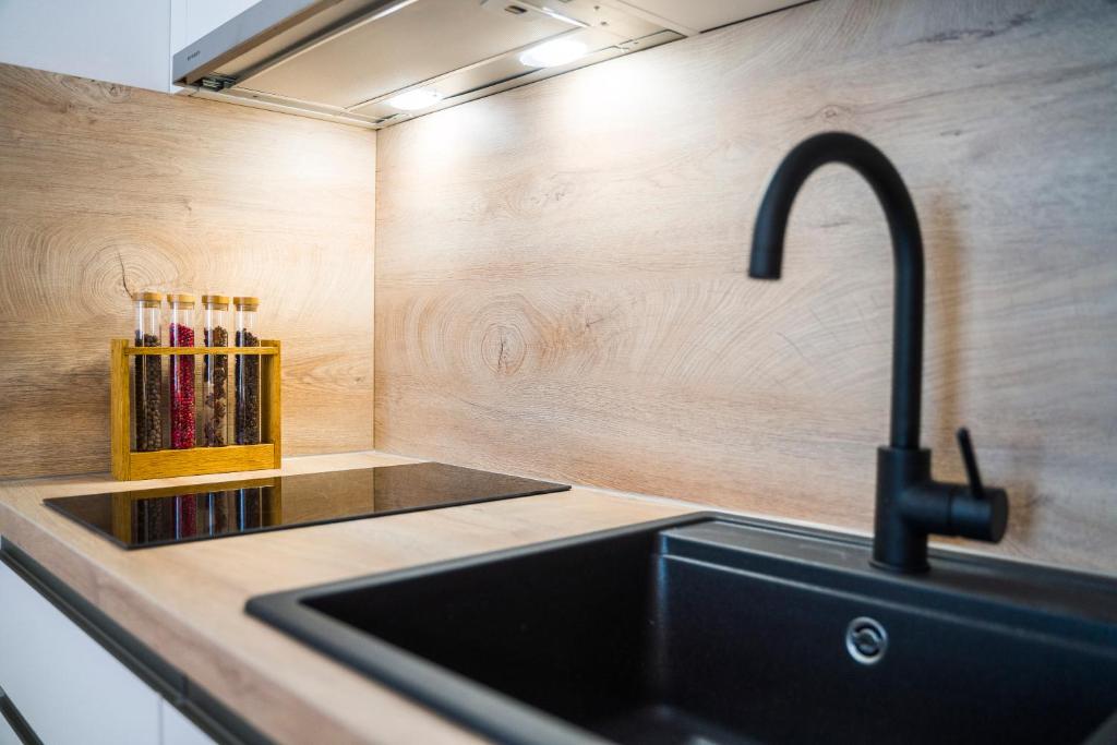Kuchyňa alebo kuchynka v ubytovaní RC Apartment
