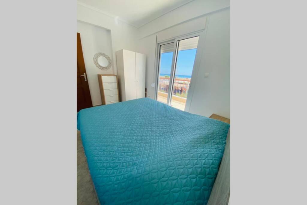 Postel nebo postele na pokoji v ubytování Lucas2 Lux Flogita apartment