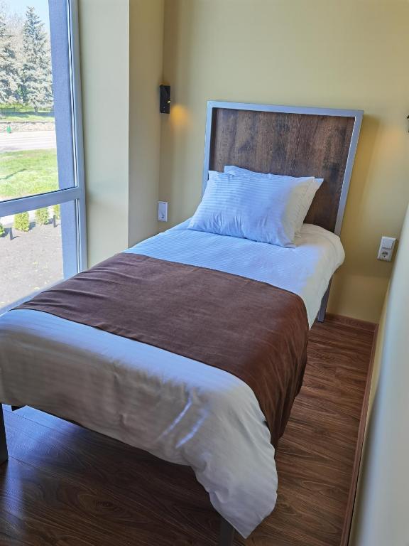 Postel nebo postele na pokoji v ubytování STARK HOTEL