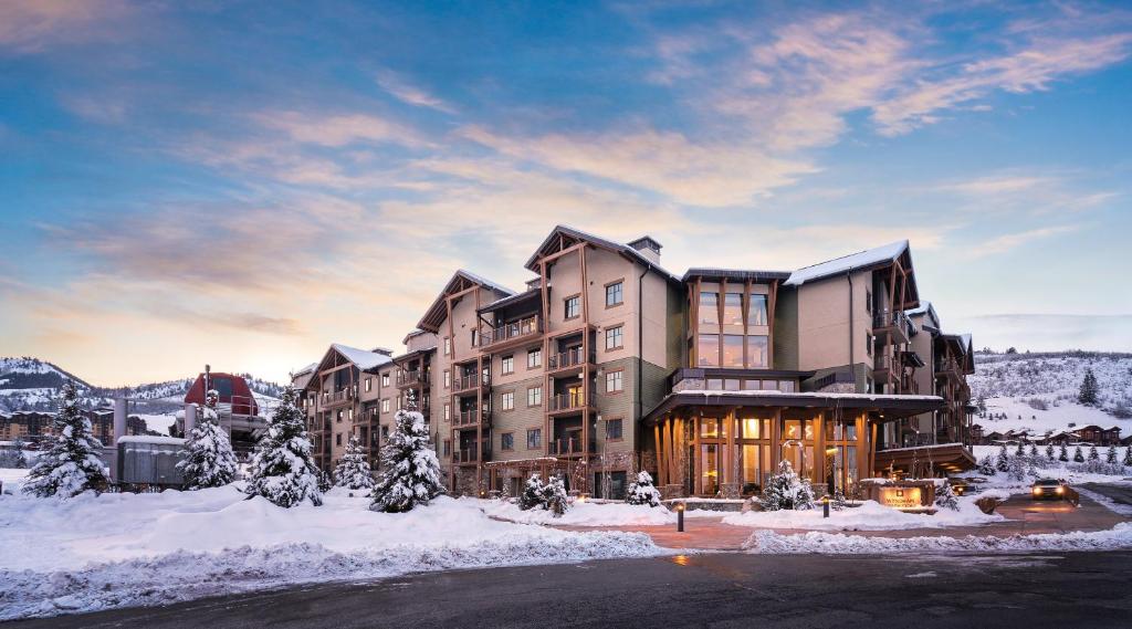 a large building with snow on the ground at Club Wyndham Park City in Park City