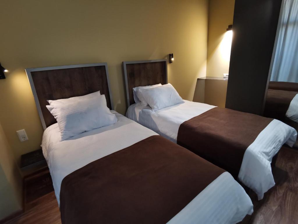 Postel nebo postele na pokoji v ubytování STARK HOTEL