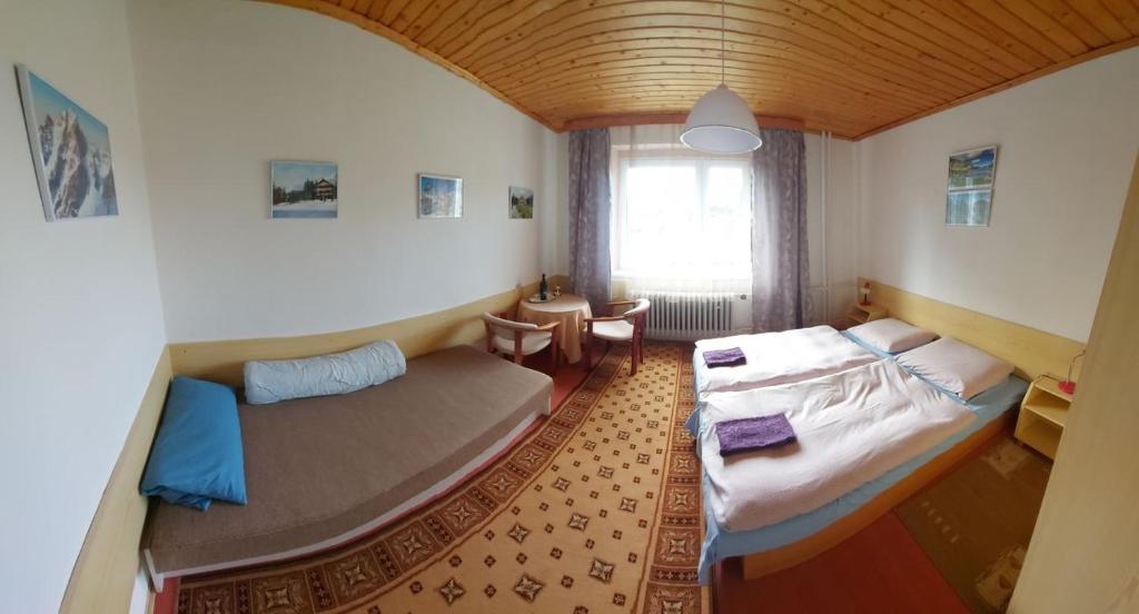 Postel nebo postele na pokoji v ubytování Pension MAAN