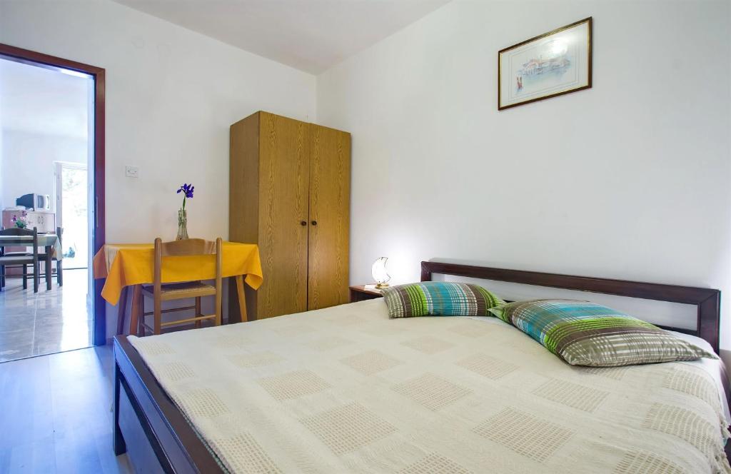 Postel nebo postele na pokoji v ubytování Apartments Iris