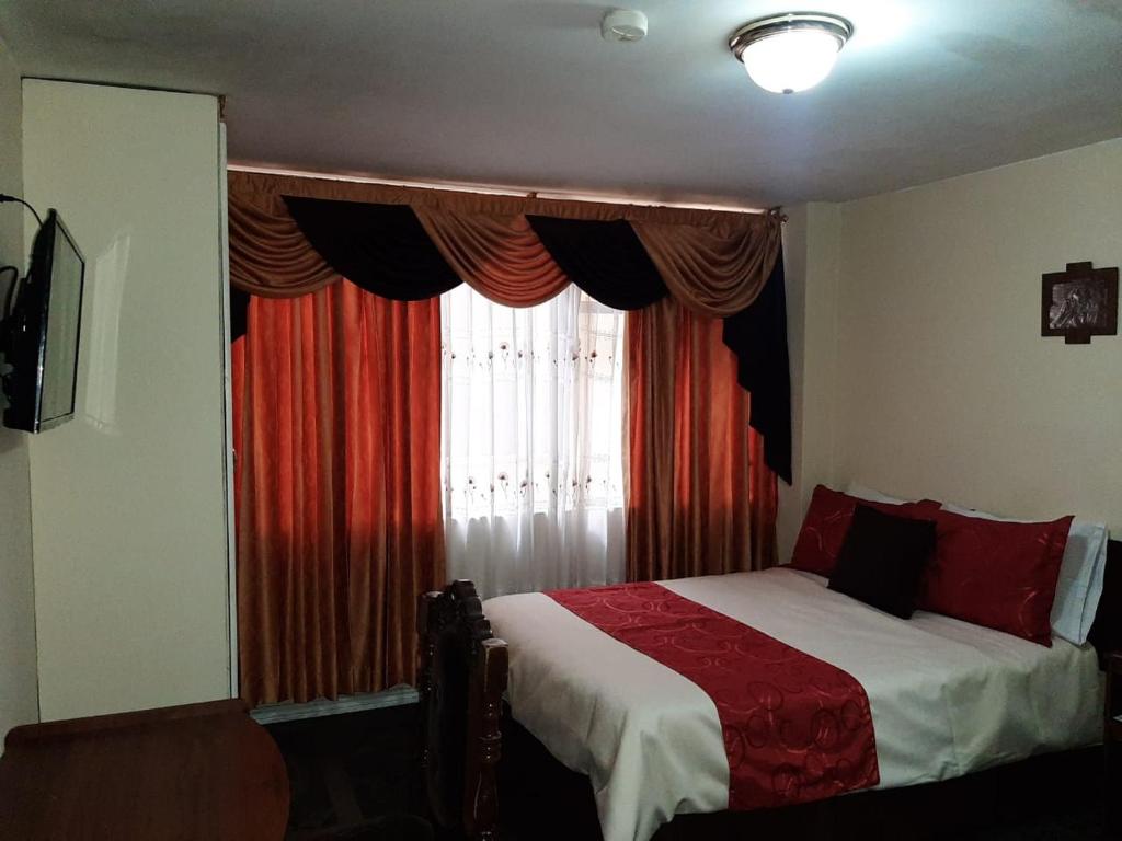 Postel nebo postele na pokoji v ubytování Hotel Bonaventure