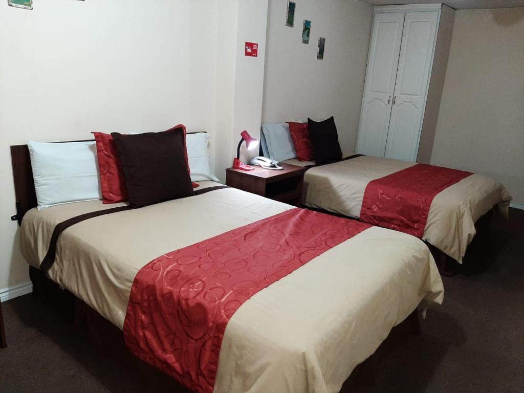 Postel nebo postele na pokoji v ubytování Hotel Bonaventure