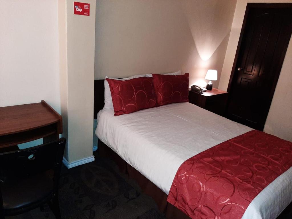 Postel nebo postele na pokoji v ubytování Hotel Bonaventure
