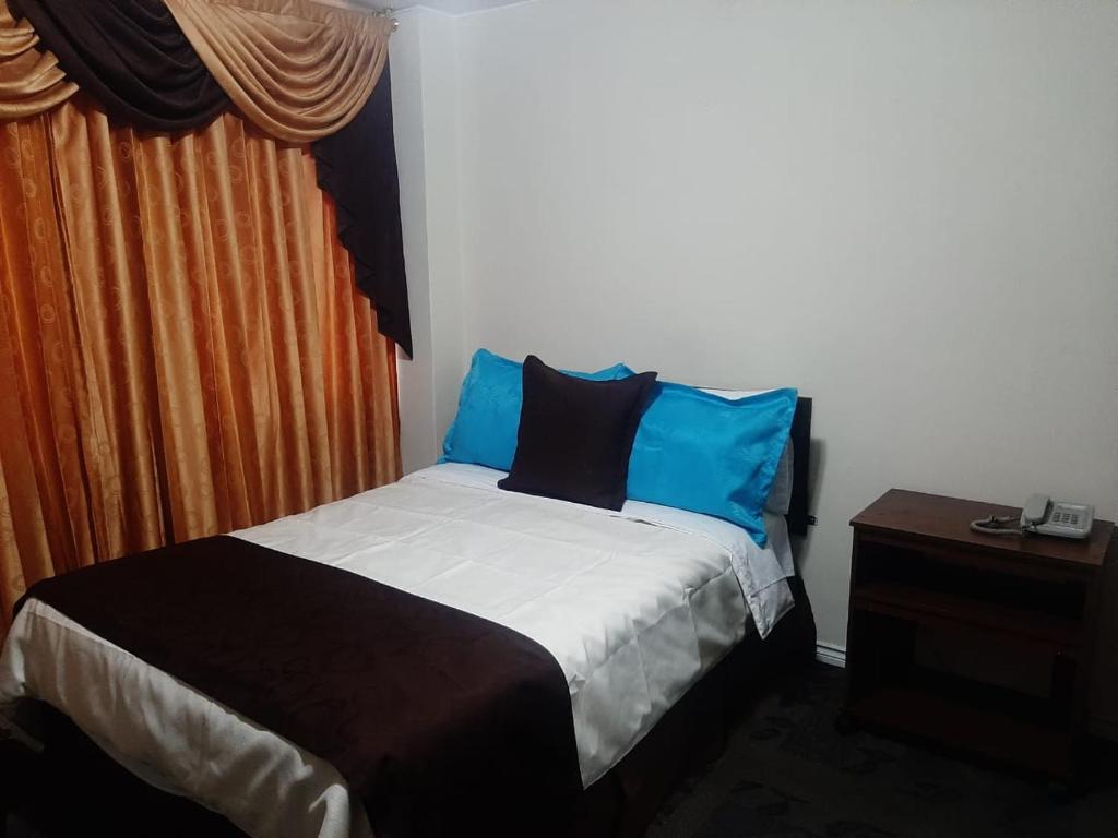 Postel nebo postele na pokoji v ubytování Hotel Bonaventure
