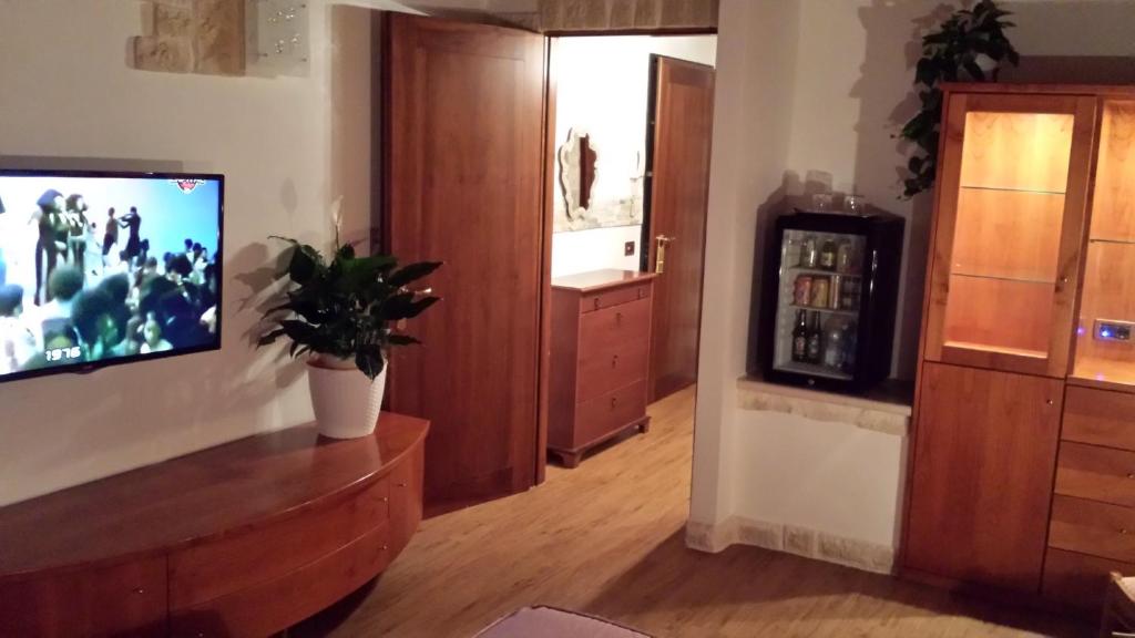 TV a/nebo společenská místnost v ubytování Ca'Nova Alloggi