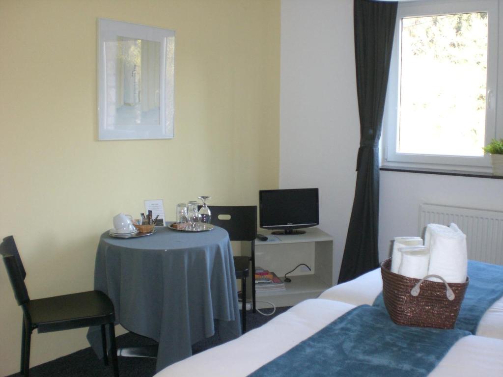 Postel nebo postele na pokoji v ubytování B&B L'ourthe