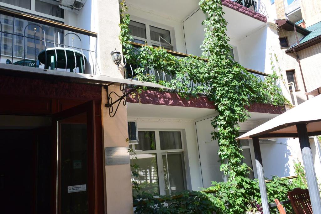 a building with ivy growing up the side of it at Private Residence Osobnyak in Odesa