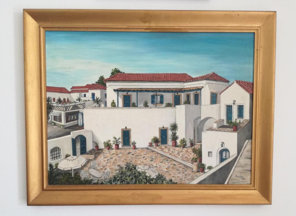 una pintura de una casa blanca en Porphyra, en Potamós