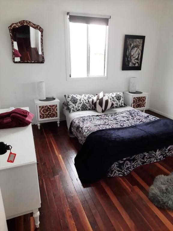 a living room with a couch and a window at Kyogle Comfy Homestay in Kyogle