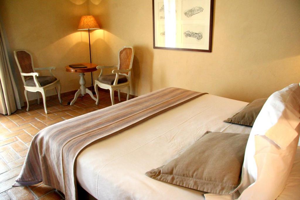 Postel nebo postele na pokoji v ubytování Mas Salvi Country Boutique Hotel