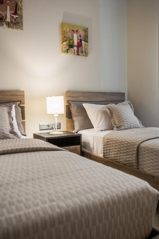 A bed or beds in a room at Serenity Home