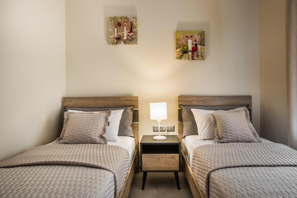 A bed or beds in a room at Serenity Home